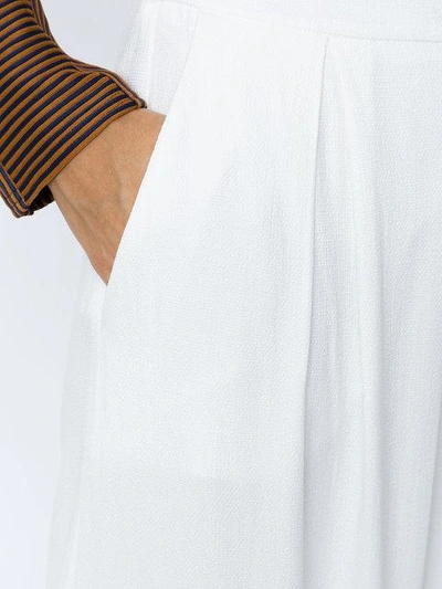 Shop Alcaçuz Pleated Cropped Trousers In White