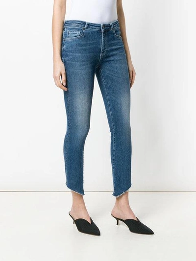 cropped faded jeans