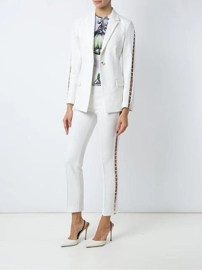 Shop Versace Skinny Stretch Trousers In White