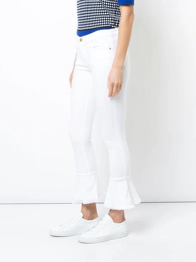 Shop Frame Flared Cuff Skinny Jeans In White
