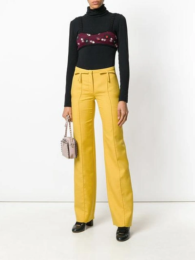 Shop Valentino Bow Detail Flared Trousers In 0c6