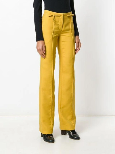 Shop Valentino Bow Detail Flared Trousers In 0c6