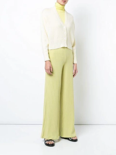 Shop Simon Miller Ribbed Flared Trousers In Yellow