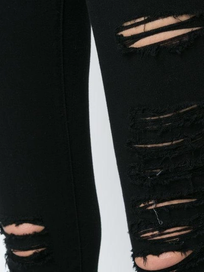 Shop Frame Ripped Skinny Jeans In Black