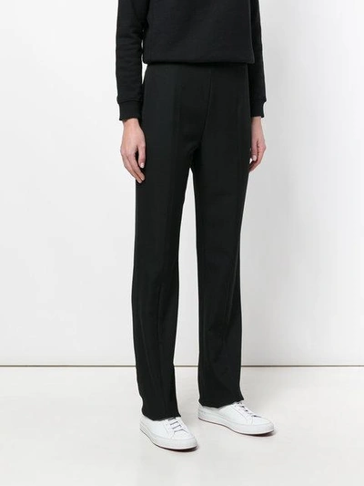 COURRÈGES HIGH-WAISTED FLARED TROUSERS 218P02100712834726