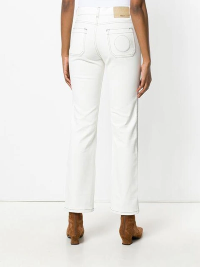 Shop Chloé Exposed Stitch Trousers In White