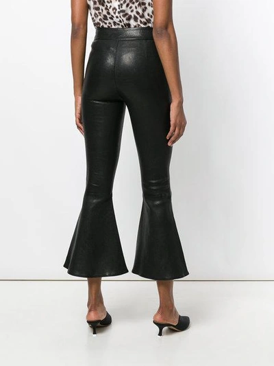 flared hem trousers