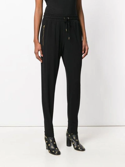 Shop Michael Michael Kors Tapered Jogger Trousers In Black