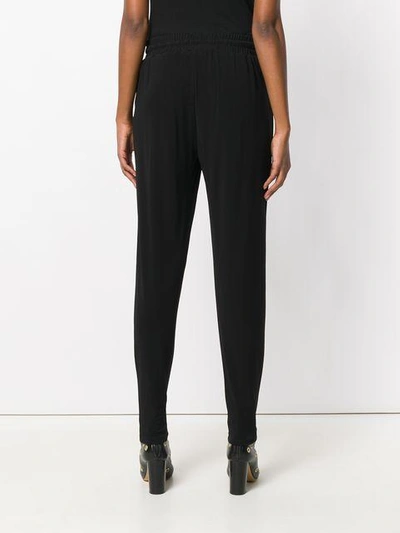 Shop Michael Michael Kors Tapered Jogger Trousers In Black