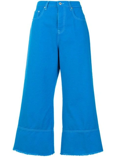 Shop Msgm Cropped Flare Jeans In Blue