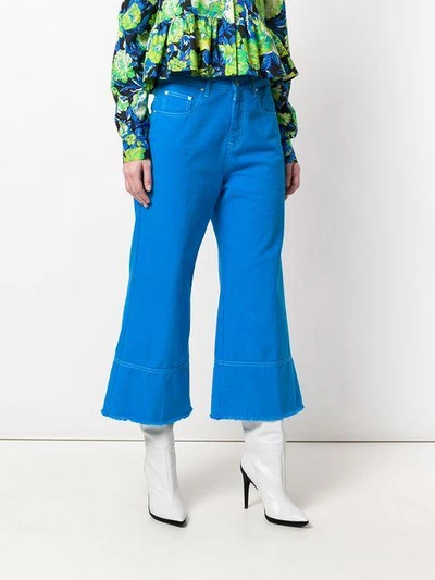 Shop Msgm Cropped Flare Jeans In Blue