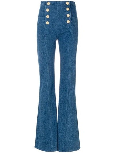 Shop Balmain Button-embellished Flared Jeans - Blue