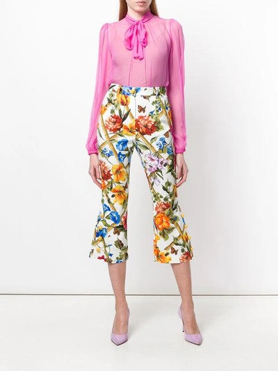 Shop Dolce & Gabbana Floral Print Flared Cropped Trousers In White