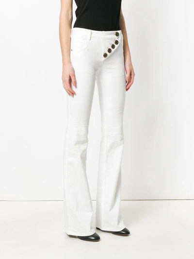 Shop Chloé Flared Jeans In White