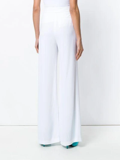 Shop Msgm Palazzo Trousers In White
