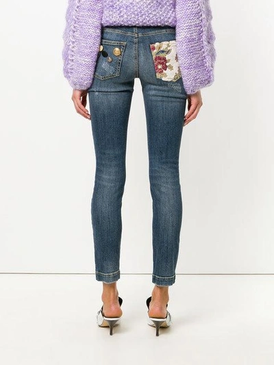 Shop Dolce & Gabbana Button Embellished And Brocade Appliqué Distressed Jeans - Blue