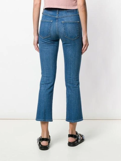 Shop Amo Flared Cropped Jeans In Blue