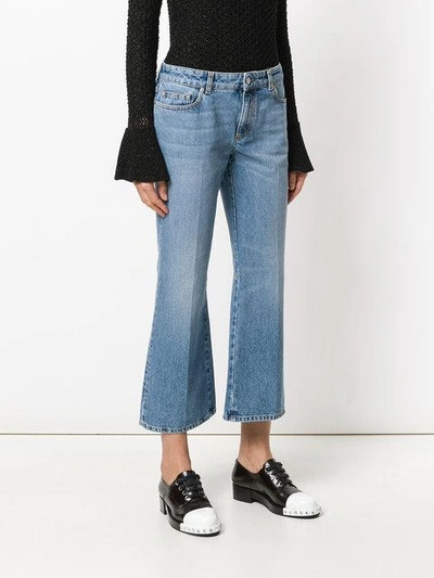 Shop Alexander Mcqueen Embroidered Flared Jeans In Blue