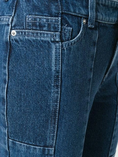 Shop Alexander Mcqueen Asymmetric Flared Cropped Jeans In Blue