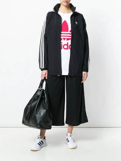 Shop Adidas Originals 3-striped Windbreaker Jacket In Black