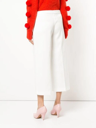 Shop Boutique Moschino Cropped Wide Leg Trousers In White