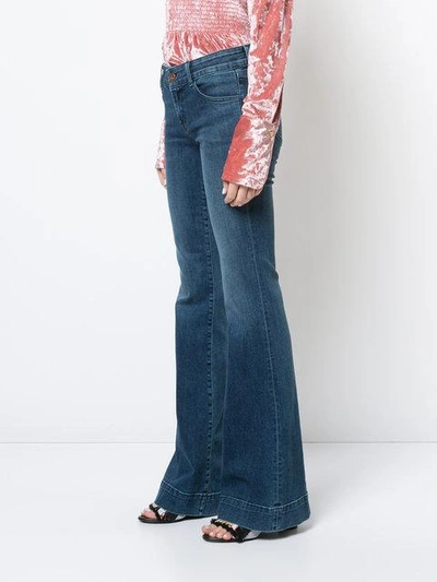 Shop J Brand Flared Jeans - Blue