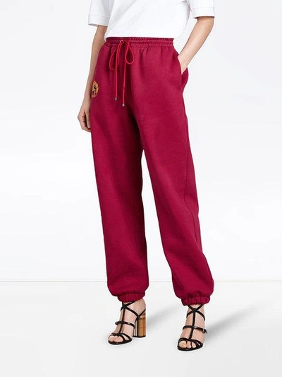 Shop Burberry Embroidered Logo Jersey Sweatpants In Red