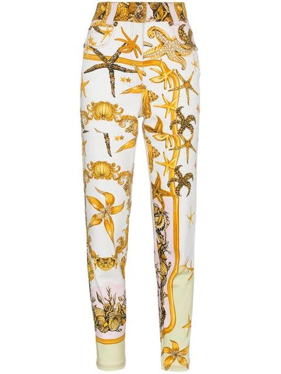 Shop Versace High Rise Jeans With Marine Print In Yellow