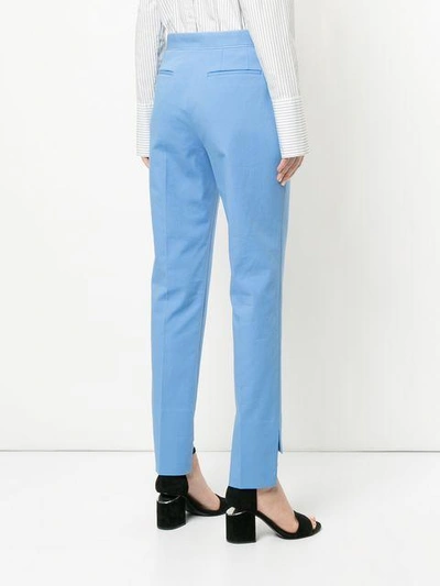 Shop Rosetta Getty Contrast Stitch Tapered Trousers In Blue