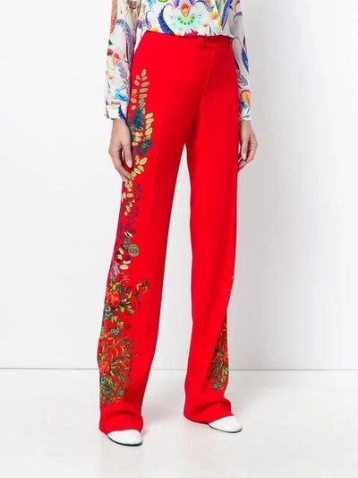 Shop Etro Floral Print Flared Trousers In Red