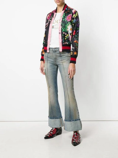 Shop Gucci Embroidered Flared Jeans With Turned Cuffs In Blue
