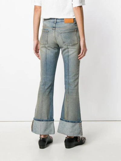 Shop Gucci Embroidered Flared Jeans With Turned Cuffs In Blue