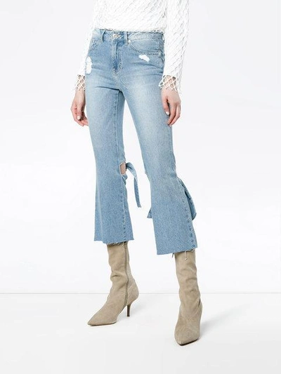 Shop Sjyp Bow Detail High Rise Flared Jeans In Blue