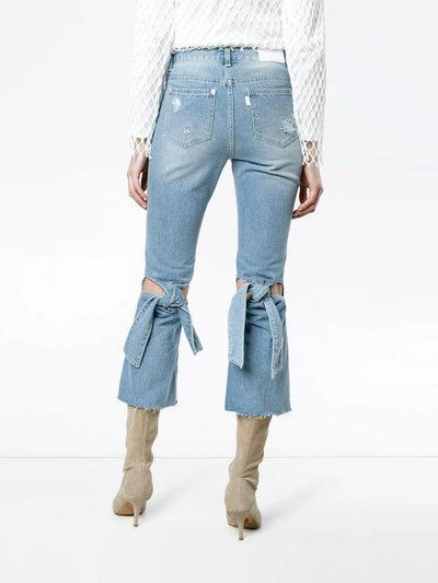 Shop Sjyp Bow Detail High Rise Flared Jeans In Blue