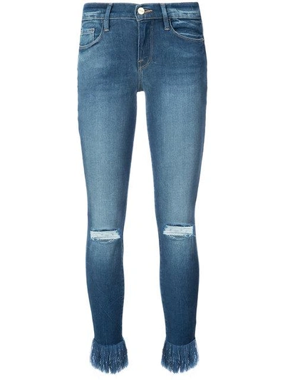 Shop Frame Frayed Ankle Jeans In Blue