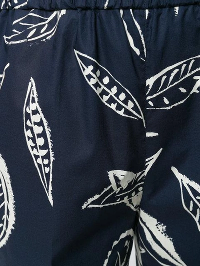 Shop Aspesi Leaf Print Trousers - Blue