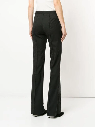 Shop Versace Tailored Flare Trousers In Black