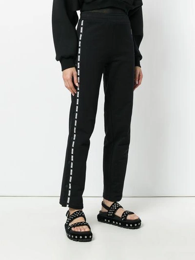 Shop Msgm Brand Stripe Tracksuit Trousers In Black