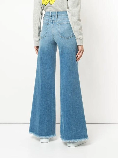 Shop Frame Le Palazzo Raw Edge Jeans In Blue