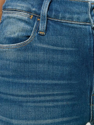 Shop Frame Flared Denim Jeans In Blue
