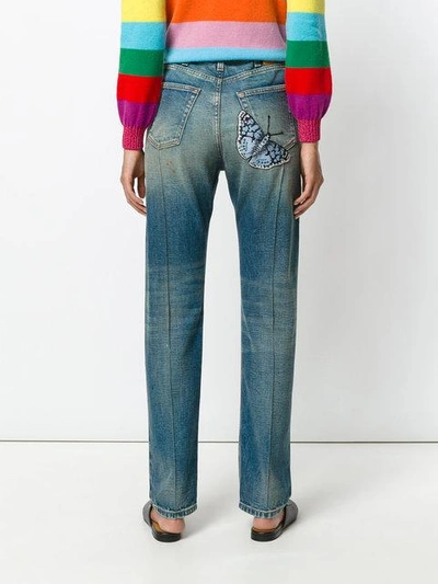 Shop Gucci Embroidered Faded Jeans In Blue