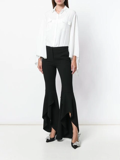 Shop Pinko Asymmetric Frill Cuff Trousers In Black