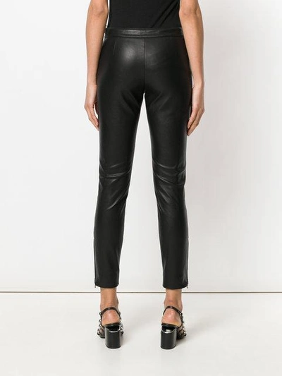 Shop Moschino Faux-leather Zip Detail Trousers In Black