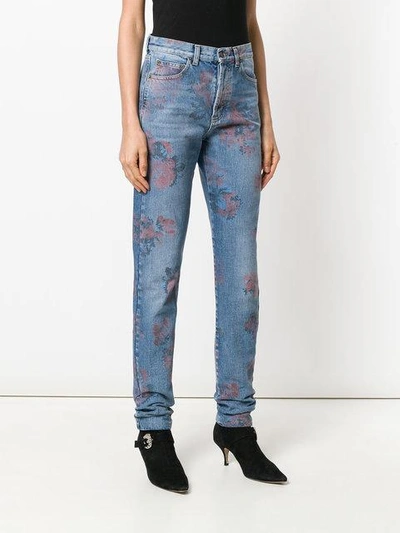 Shop Saint Laurent Floral Print Jeans In Blue