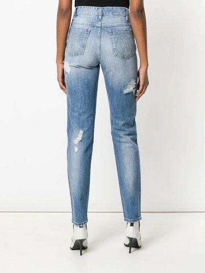 Shop Moschino Distressed Denim Trousers In Blue