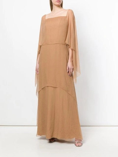 layered evening dress with asymmetrical sleeves