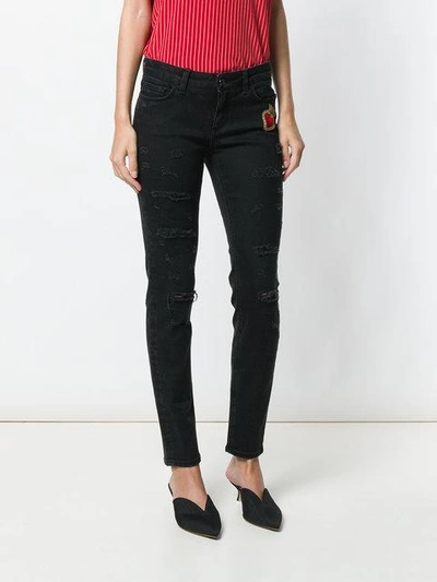 Shop Dolce & Gabbana Sacred Heart Skinny Jeans In Black