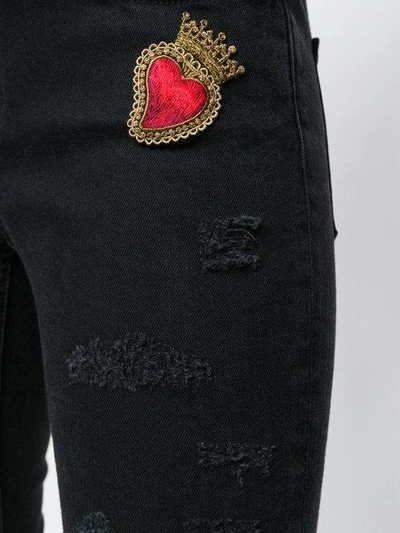 Shop Dolce & Gabbana Sacred Heart Skinny Jeans In Black