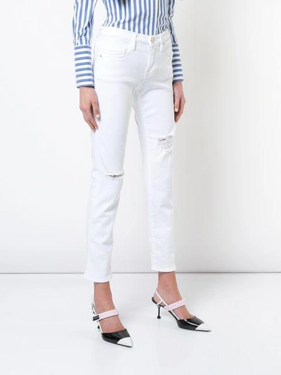 Shop Frame Distressed Skinny Jeans In White