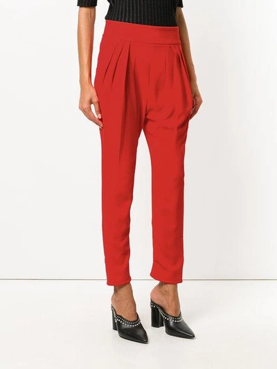 Shop Givenchy Tapered Trousers In Red